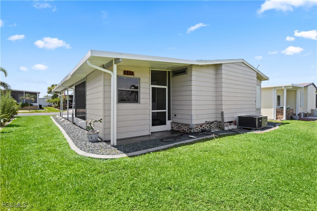 15550 Burnt Store Road, Unit 229 Punta Gorda, FL 33955 - Photo 24 of 41 a view of a house with backyard