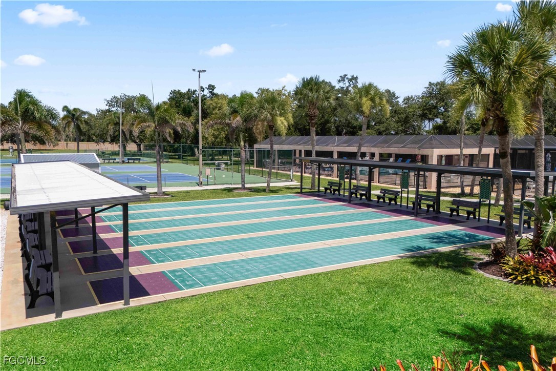 15550 Burnt Store Road, Unit 229 Punta Gorda, FL 33955 - Photo 36 of 41 a view of a backyard and floor to ceiling window