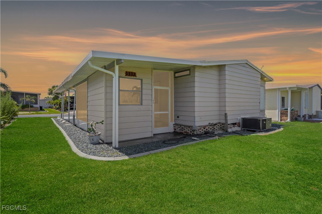 15550 Burnt Store Road, Unit 229 Punta Gorda, FL 33955 - Photo 4 of 41 a view of a house with backyard