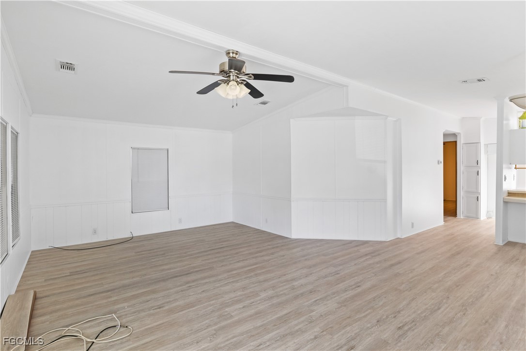 15550 Burnt Store Road, Unit 229 Punta Gorda, FL 33955 - Photo 7 of 41 a view of empty room with wooden floor