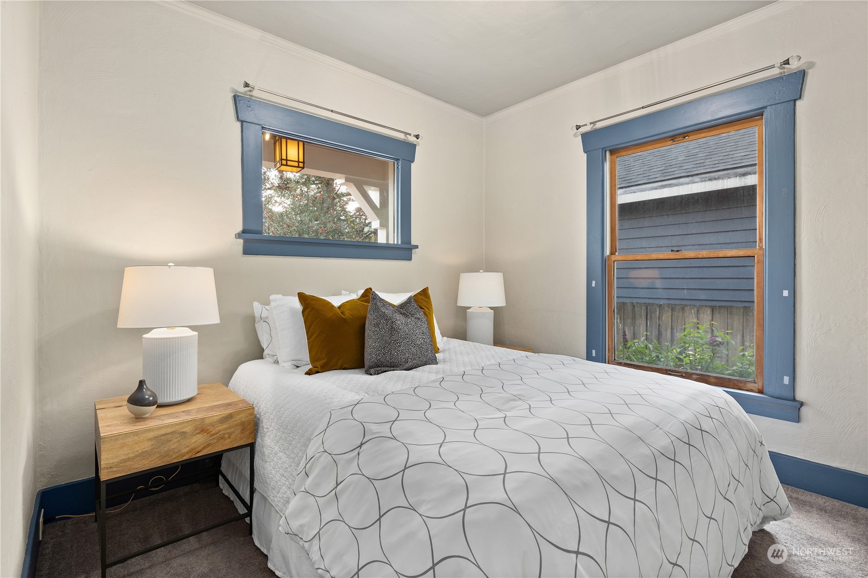 3317 30th Avenue Southwest Seattle, WA 98126 - Photo 14 of 28 a bedroom with a bed and a window