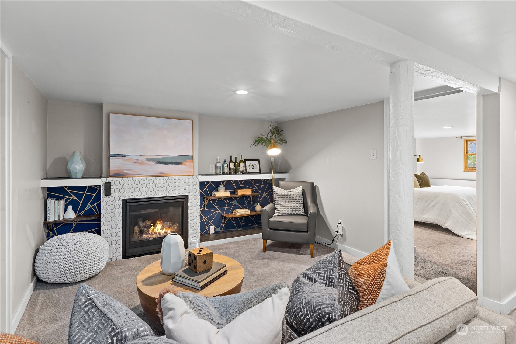 3317 30th Avenue Southwest Seattle, WA 98126 - Photo 19 of 28 a living room with furniture and a fireplace