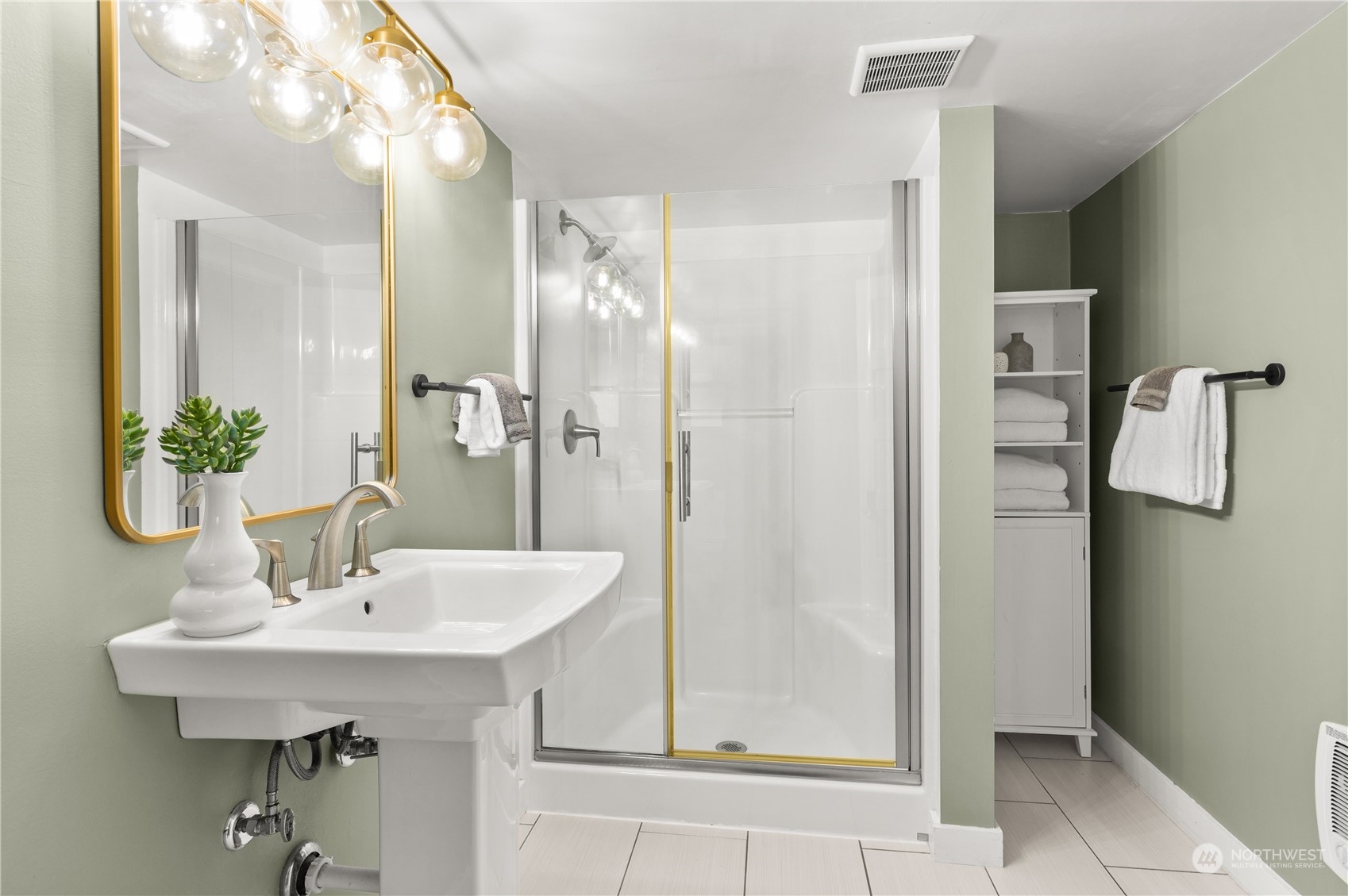 3317 30th Avenue Southwest Seattle, WA 98126 - Photo 24 of 28 a bathroom with a sink a mirror and shower