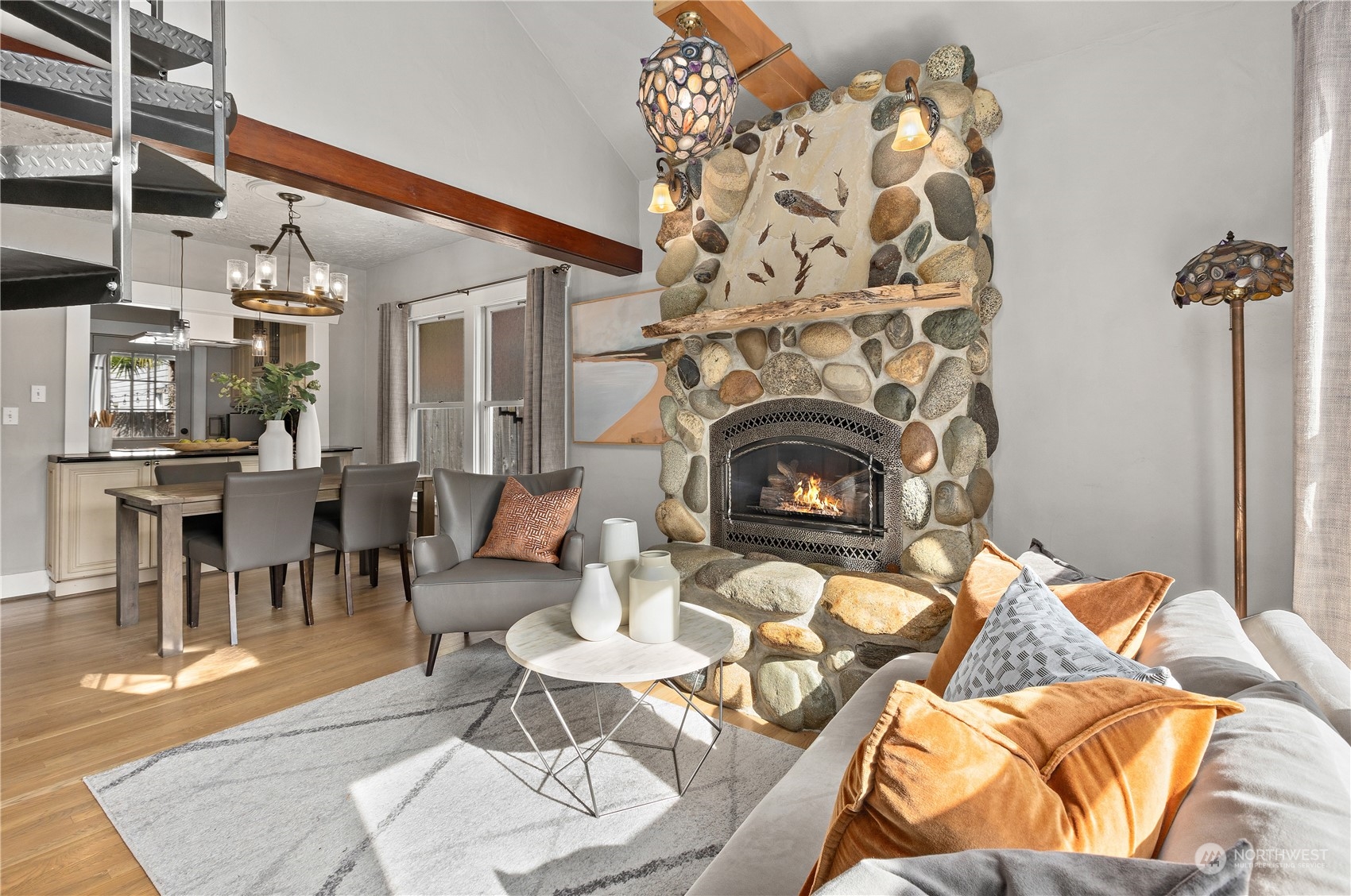 3317 30th Avenue Southwest Seattle, WA 98126 - Photo 4 of 28 an outdoor living area with furniture a fireplace and a chandelier