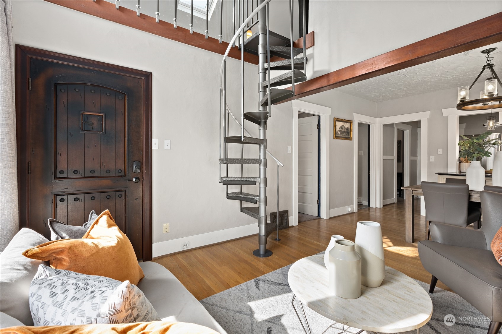3317 30th Avenue Southwest Seattle, WA 98126 - Photo 5 of 28 a bedroom with furniture and a wooden floor