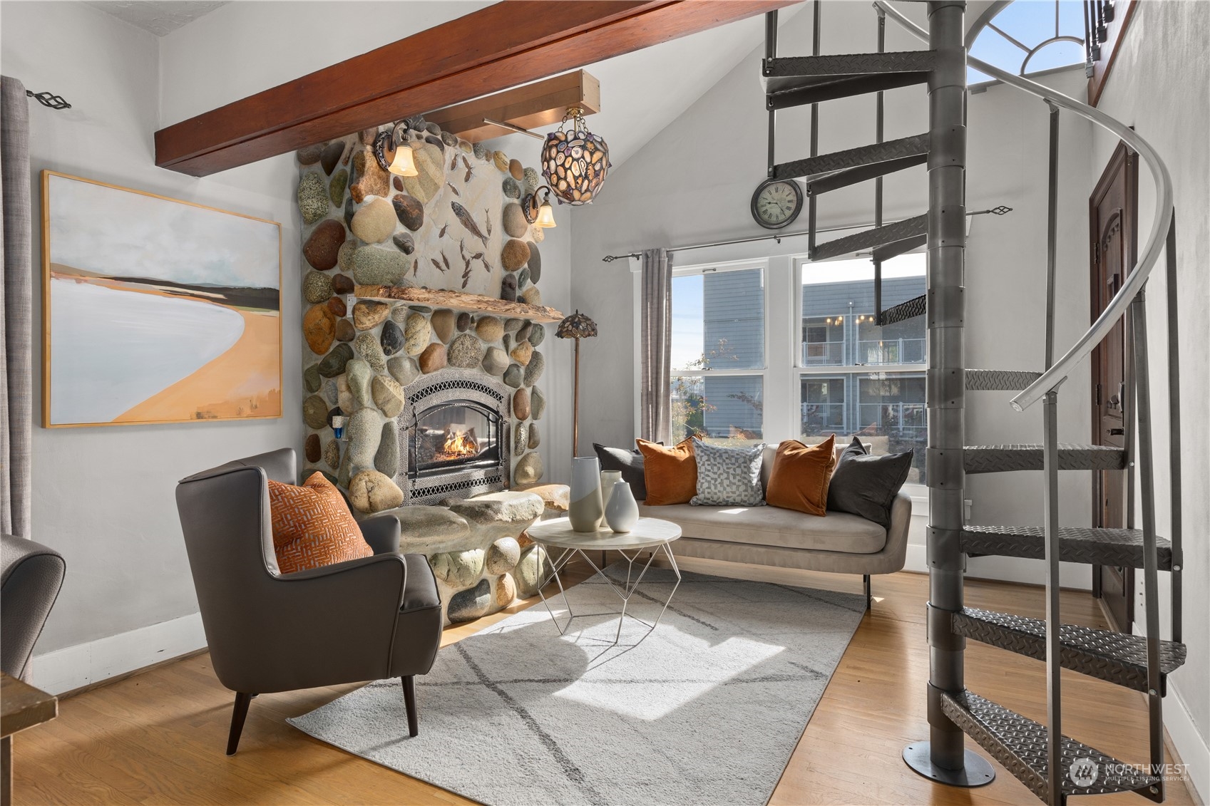 3317 30th Avenue Southwest Seattle, WA 98126 - Photo 6 of 28 a living room with furniture and a floor to ceiling window