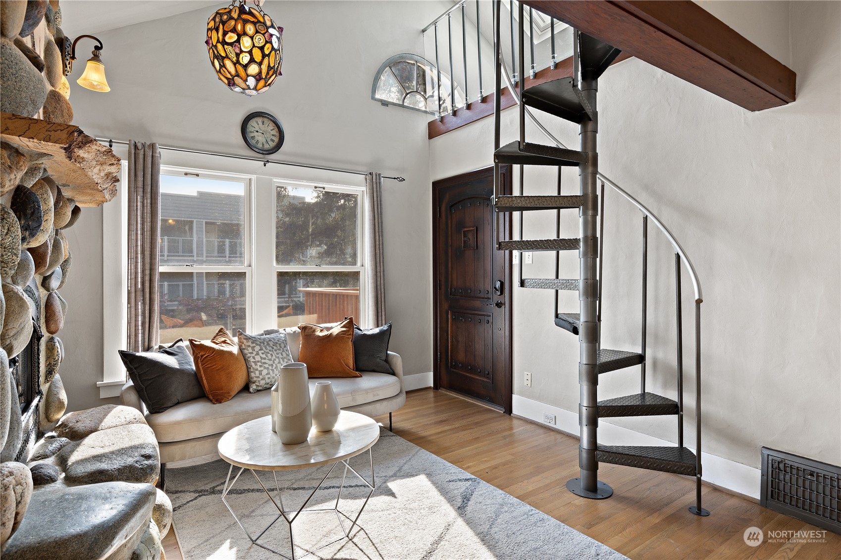 3317 30th Avenue Southwest Seattle, WA 98126 - Photo 7 of 28 a living room with furniture a rug and a large window