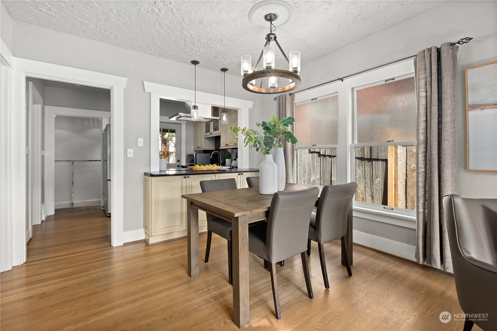 3317 30th Avenue Southwest Seattle, WA 98126 - Photo 8 of 28 a view of a dining room with furniture window and wooden floor