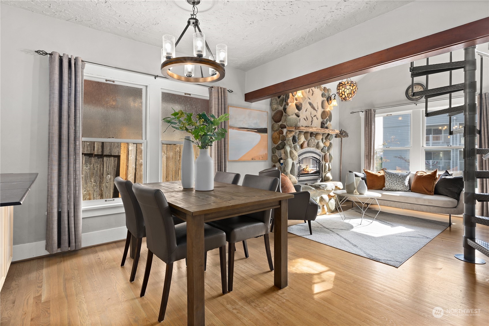 3317 30th Avenue Southwest Seattle, WA 98126 - Photo 9 of 28 a view of a dining room with furniture window and wooden floor