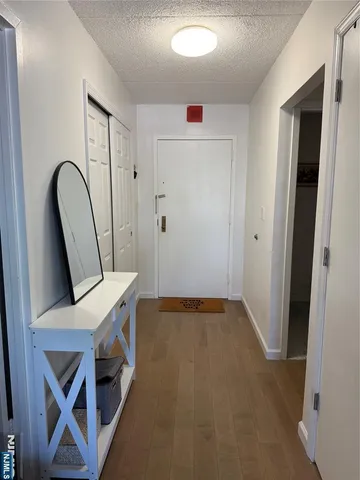 a view of a hallway with front door