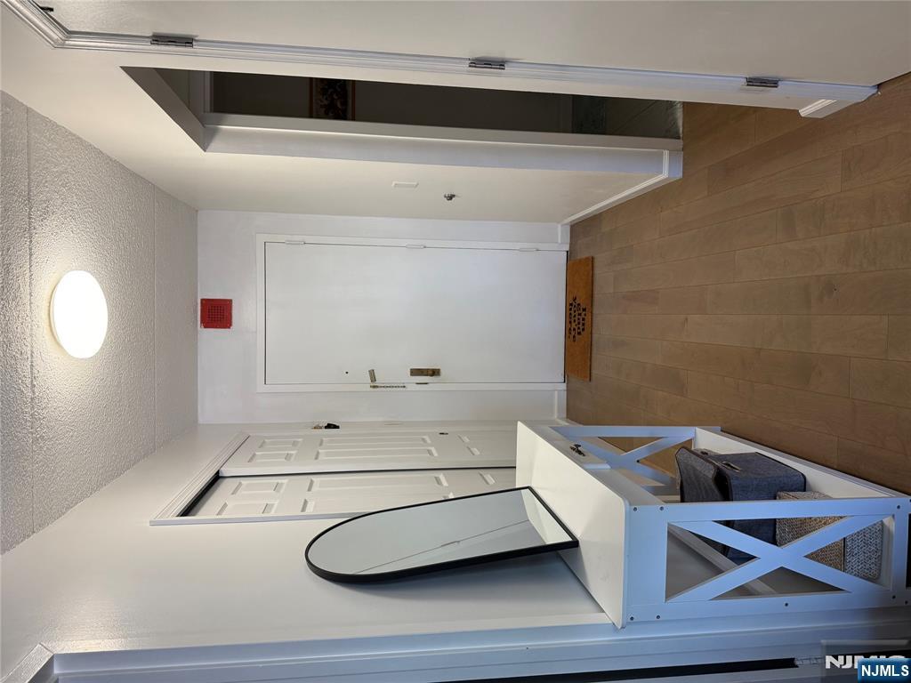 1055 River Road, Unit 504 Edgewater, NJ 07020 - Photo 2 of 17 a view of a hallway with front door