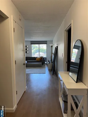 a view of a livingroom with furniture and a flat screen tv