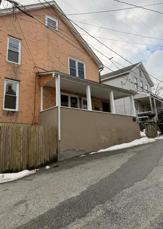 a view of a house with a street