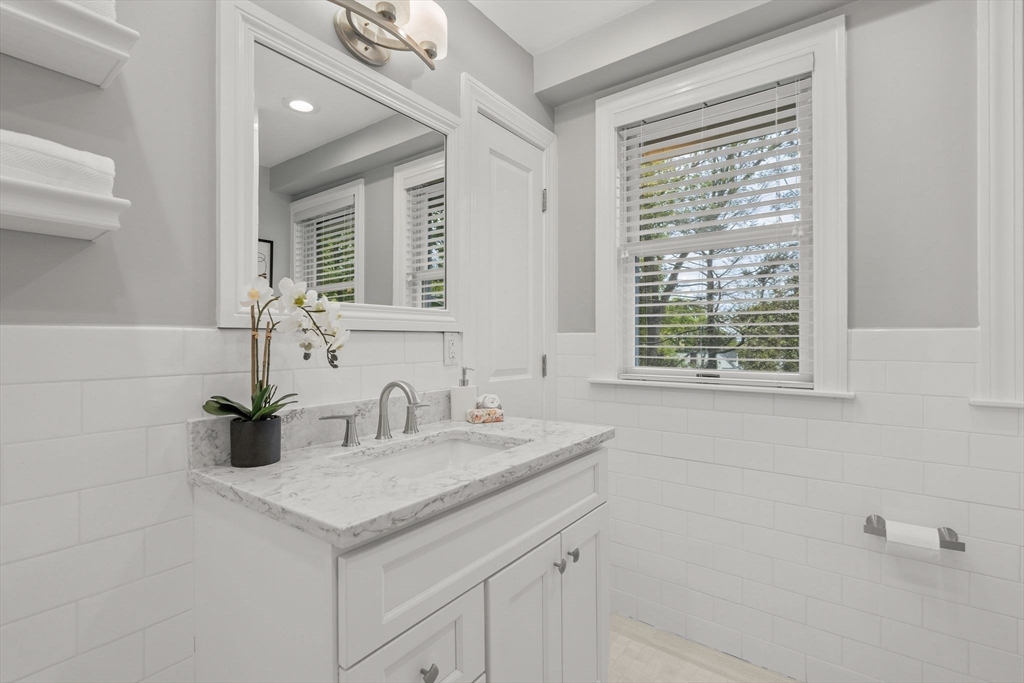 165 Park Avenue, Unit 165 Arlington, MA 02476 - Photo 17 of 32 a bathroom with a sink and a mirror