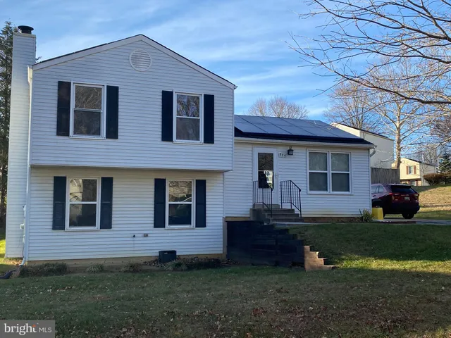 a view of house with yard