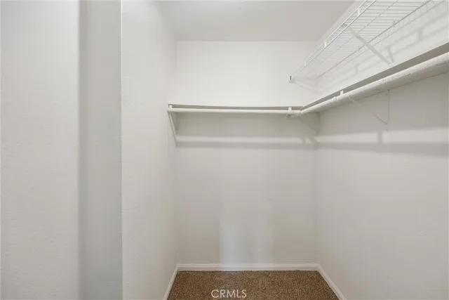 a en suite bathroom with a toilet sink and mirror