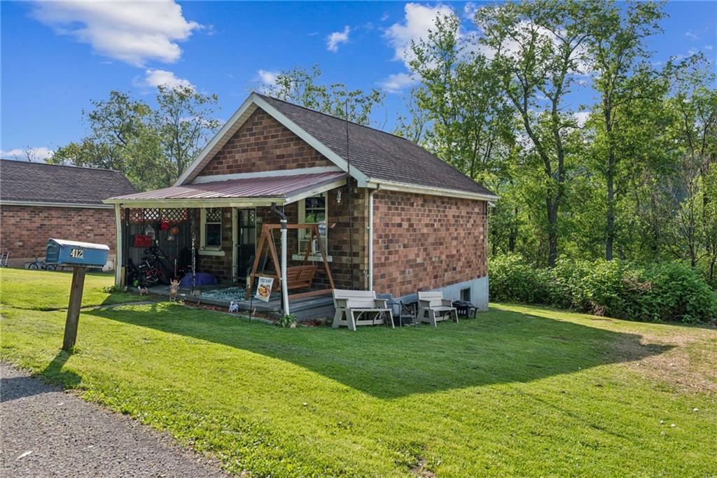 375 Reduction Road Smithton, PA 15479 - Photo 25 of 30 a view of a house with a yard and sitting area