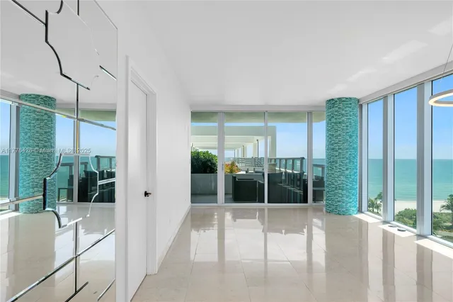 a view of a glass door and balcony