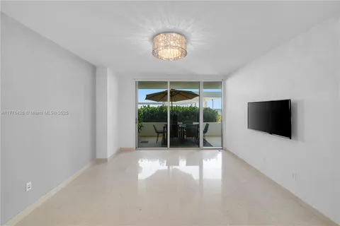 a view of a livingroom with furniture wooden floor and window