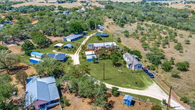 an aerial view of a houses with outdoor space