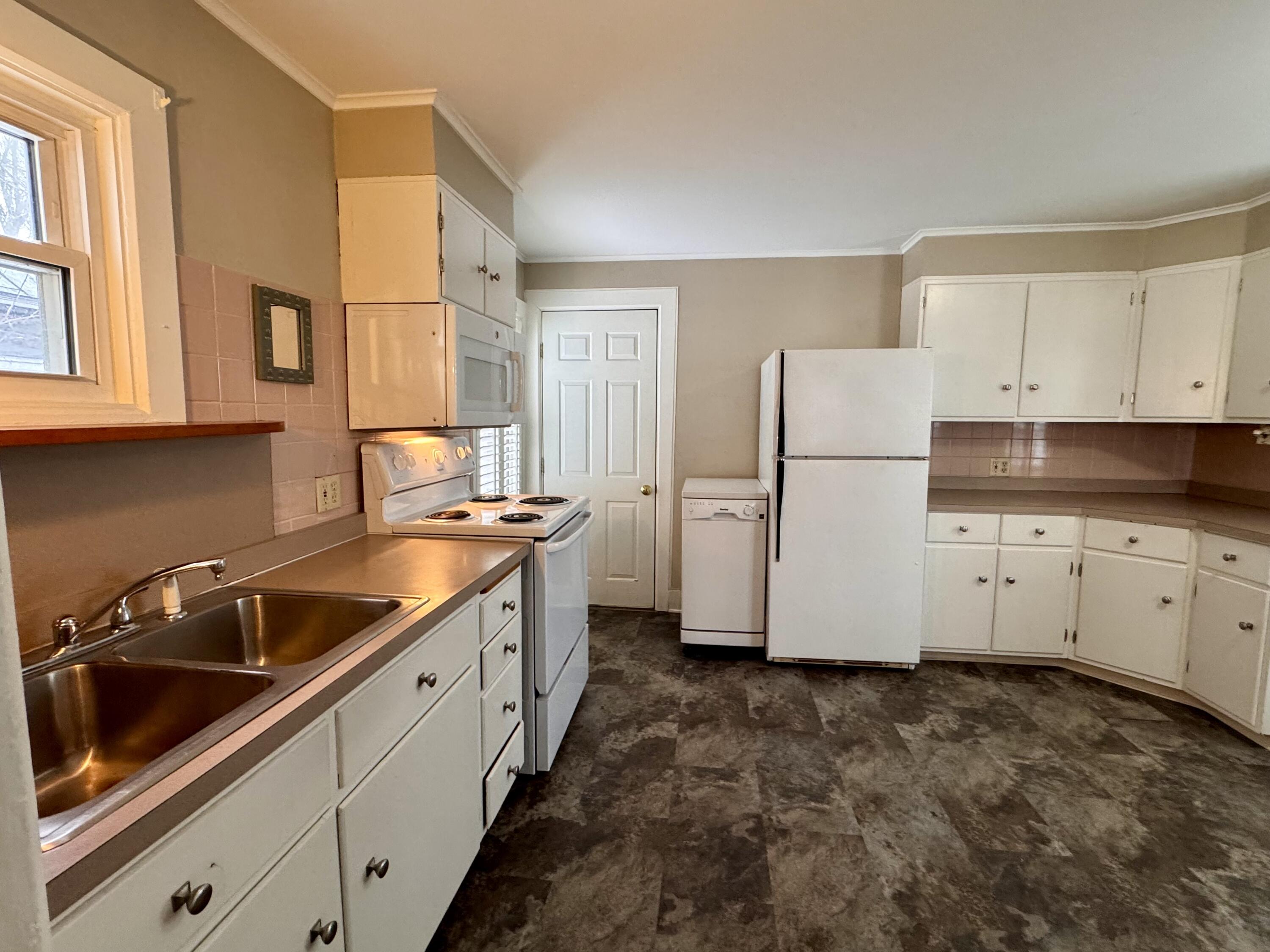 305 Main Street Waterville, ME 04901 - Photo 6 of 17 Kitchen door leads to unfinished barn!