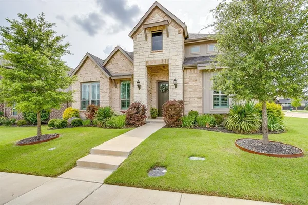 a front view of a house with a yard