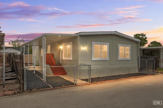 a front view of a house with parking space
