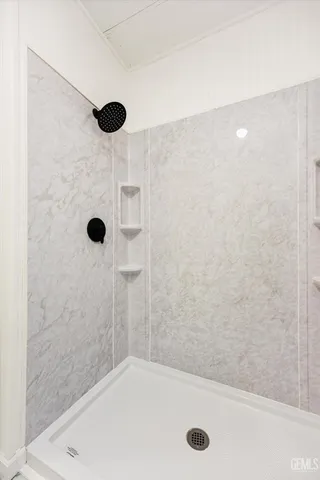 a view of a room with wooden floor and window