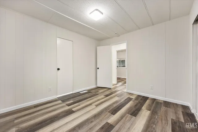 a view of kitchen and wooden floor