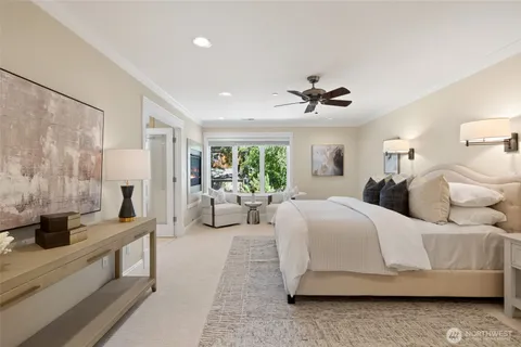a spacious bedroom with a large bed and a flat screen tv
