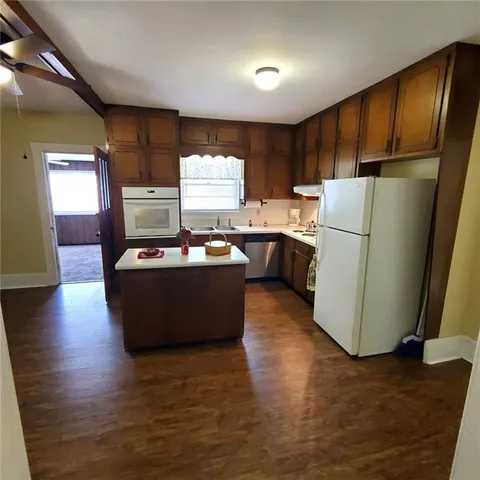 a bathroom with a sink vanity granite and a mirror