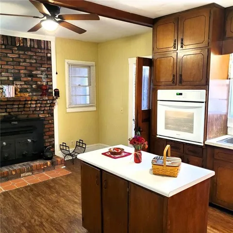 a kitchen with a sink a refrigerator and a stove
