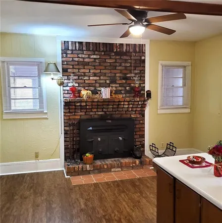 a kitchen with a sink a stove and cabinets