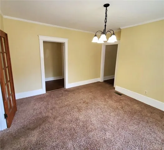 a view of a hallway to a room