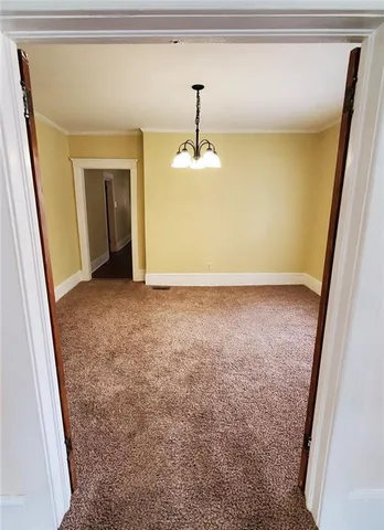 a view of room with window ceiling fan and hardwood floor