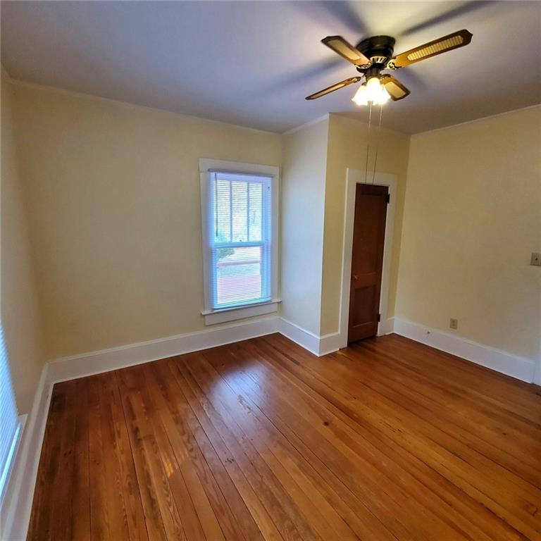 7025 Rico Road Chattahoochee Hills, GA 30268 - Photo 29 of 51 a view of empty room with wooden floor and fan