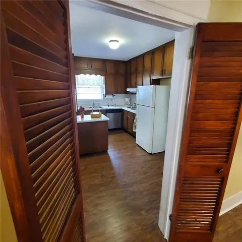 a view of entryway with wooden floor