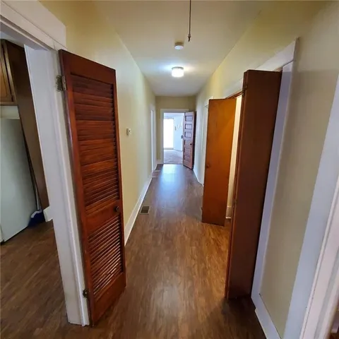 a view of a house with a yard and deck