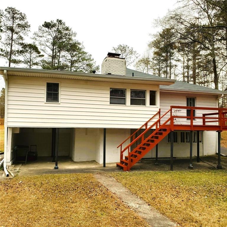 7025 Rico Road Chattahoochee Hills, GA 30268 - Photo 48 of 51 a view of a house with a yard