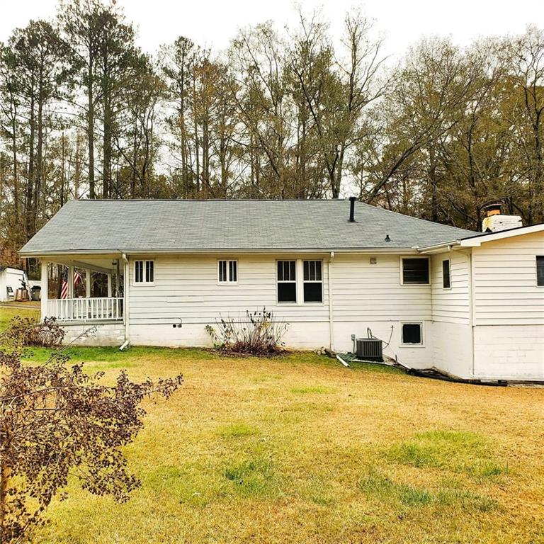 7025 Rico Road Chattahoochee Hills, GA 30268 - Photo 51 of 51 a view of a house with a yard and sitting area