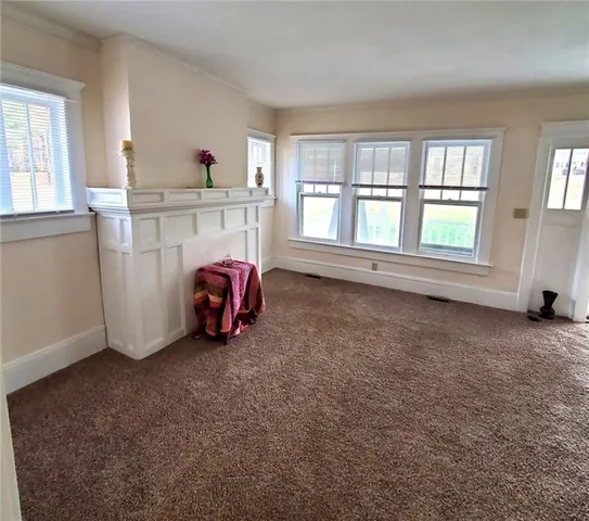 a view of empty room with closet