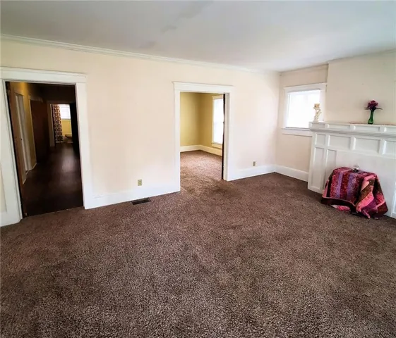 a kitchen with a refrigerator and a stove top oven
