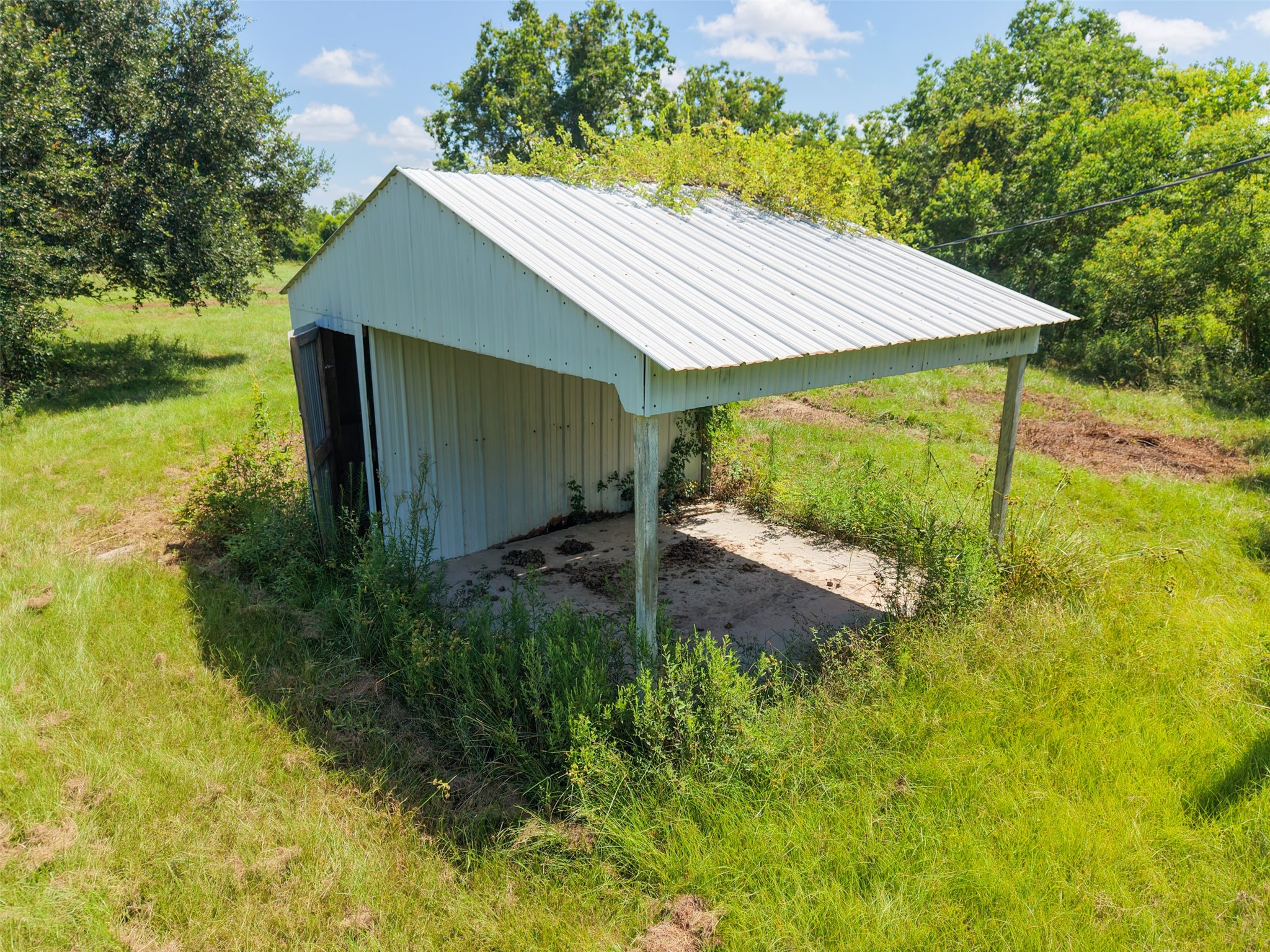 28619 Barry Lane Waller, TX 77484 - Photo 9 of 28 Covered equipment javascript:__doPostBack('m_lbDeleteChecked','')shed provides convenient storage for tractors, lawn equipment, trailers, or outdoor tools.