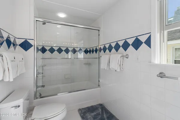 a bathroom with a shower and a toilet