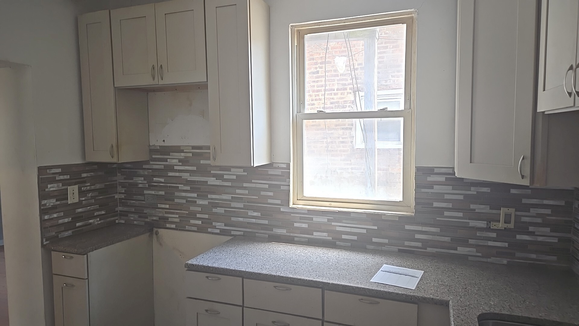 2911 West Walnut Street Chicago, IL 60612 - Photo 20 of 21 a bathroom with a sink and a window