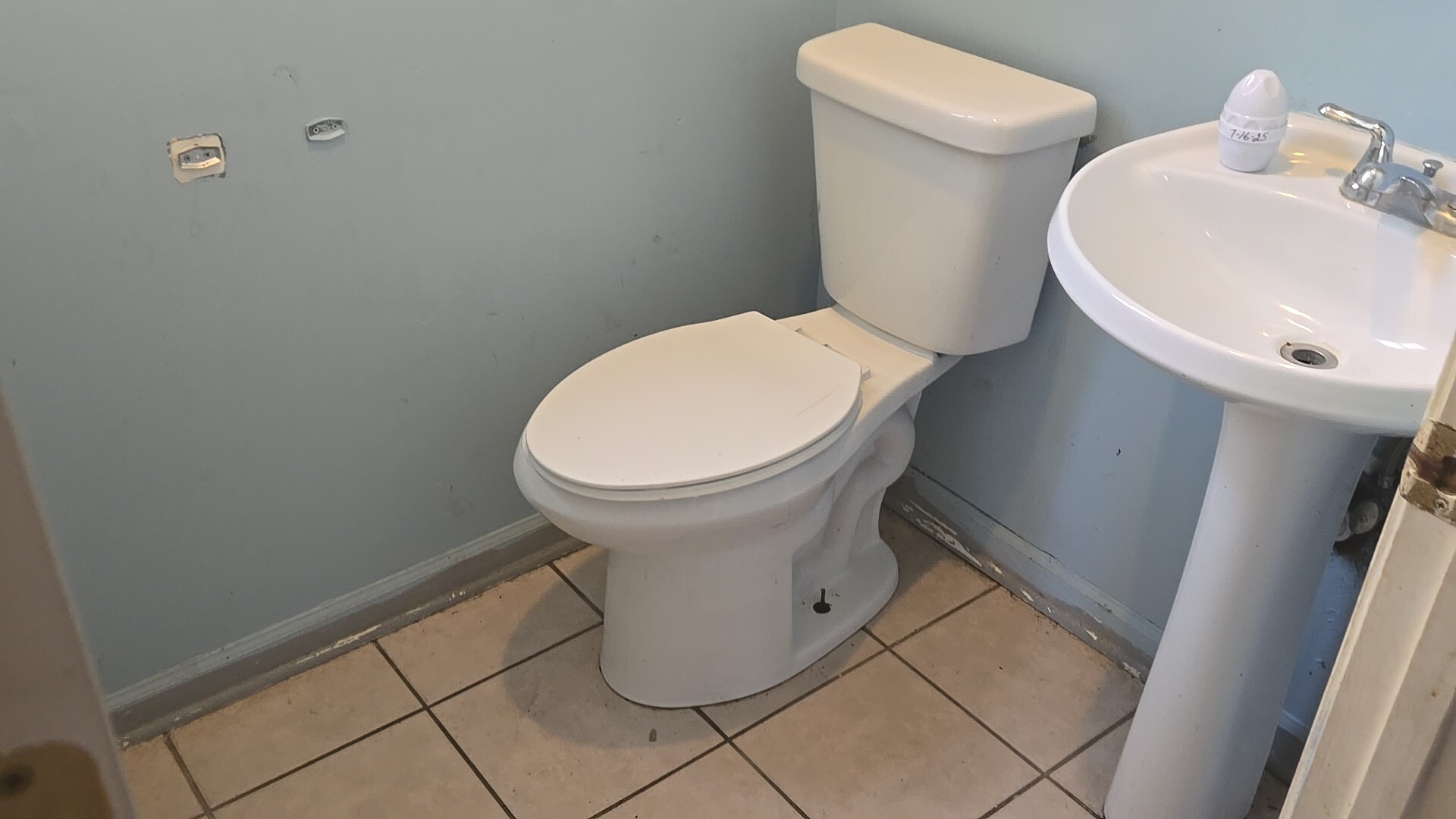 2911 West Walnut Street Chicago, IL 60612 - Photo 8 of 21 a white toilet sitting next to a white sink