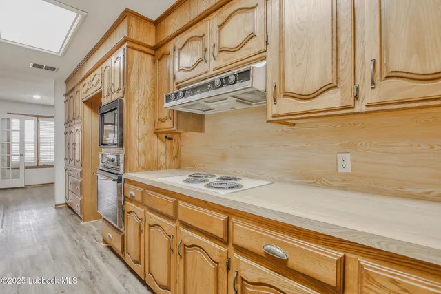 a bathroom with a sink a mirror and a shower