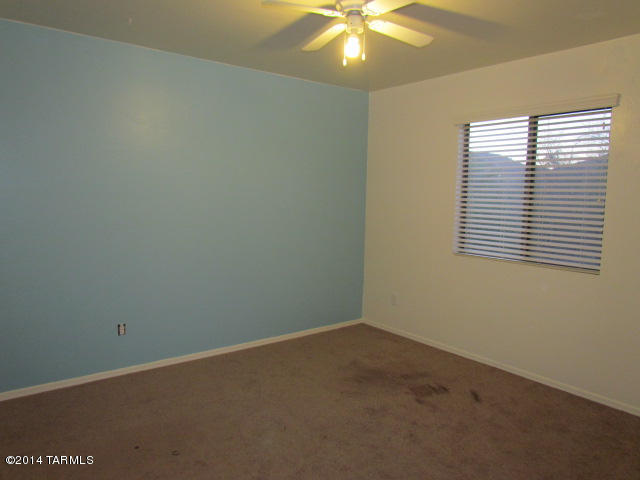 669 West Ash Ridge Drive Green Valley, AZ 85614 - Photo 15 of 17 an empty room with a window