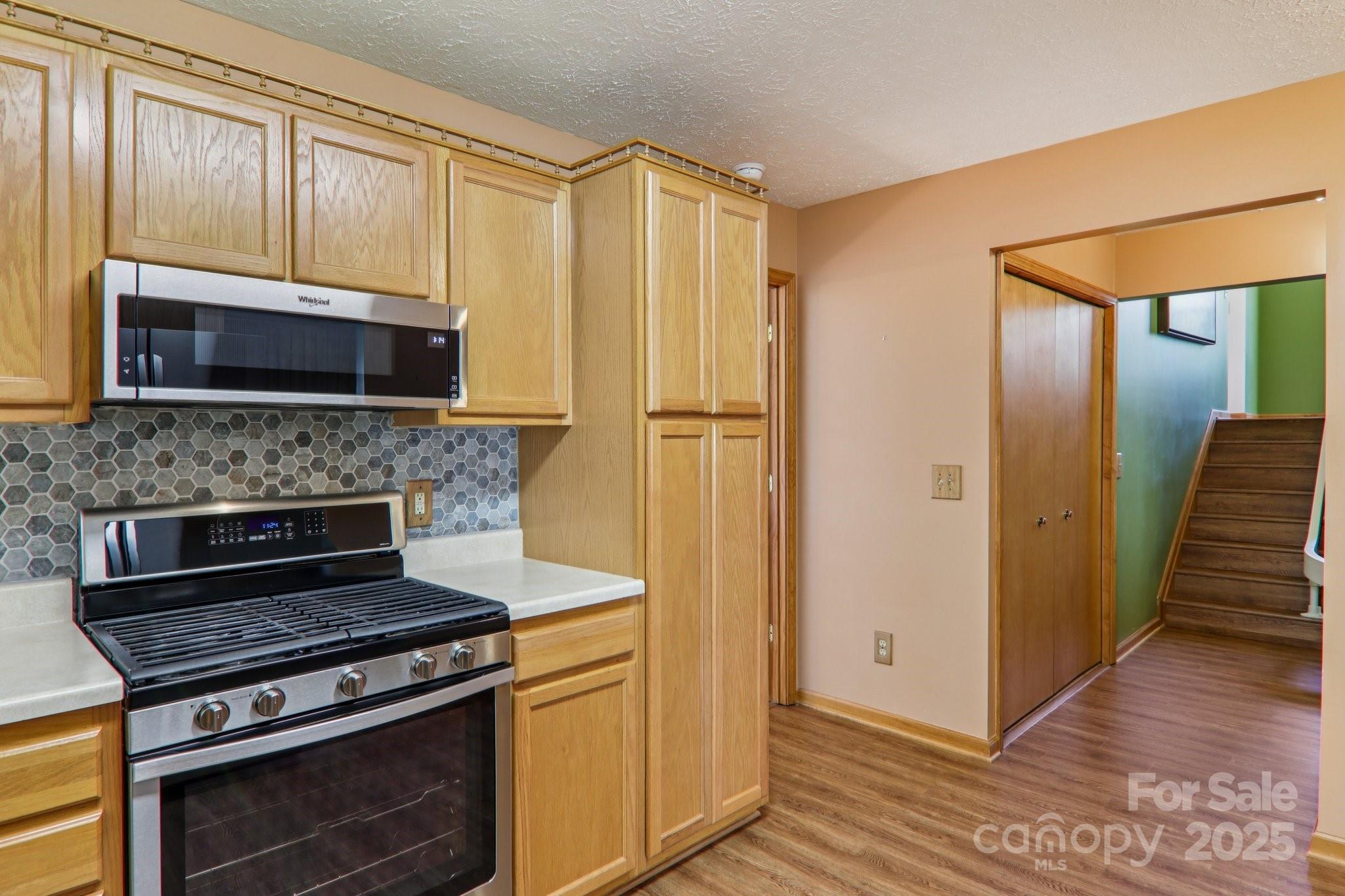 126 Pasco Loop Waynesville, NC 28785 - Photo 15 of 44 a kitchen with a stove and a microwave