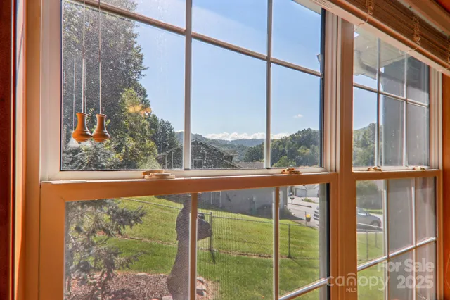 a view of a glass door with a yard